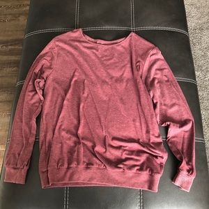 Women’s maroon long sleeve shirt.